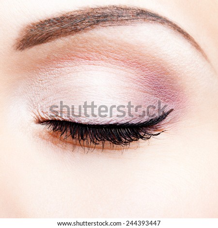 Close-up shot of closed female eye makeup