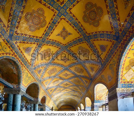 ISTANBUL, TURKEY - JULY 9, 2014: Ceiling mosaic decoration with original styled Christian cross in the Upper Gallery of the Hagia Sophia. Istanbul, Turkey
