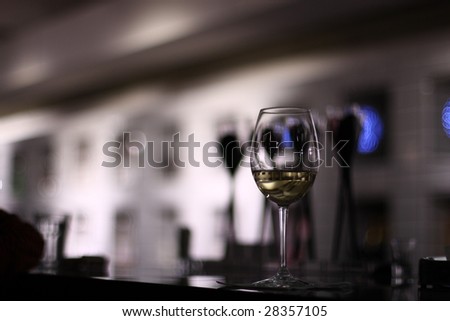 A wine glass in a club, blurred background
