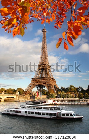 Eiffel Tower with autumn leaves in Paris France Eiffel Tower with autumn leaves in Paris France
