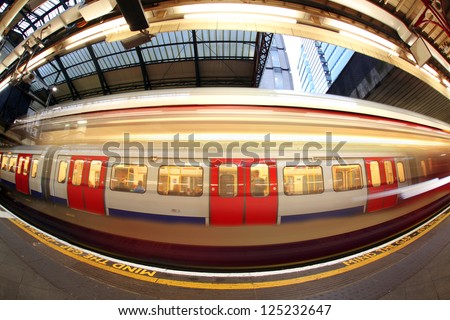 Train arriving at subway station in London, UK