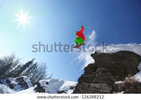 Skier during extreme jump from the rock