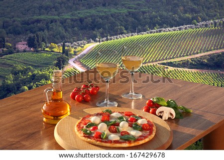 Italian Pizza And Glasses Of White Wine In Chianti, Famous Vineyard Landscape In Italy