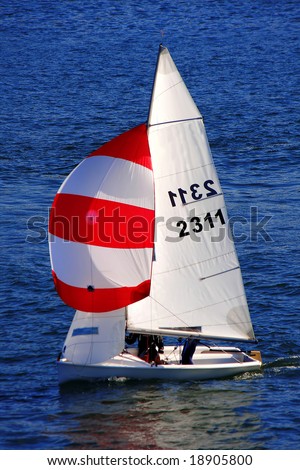 colorful sailboat in the wind on the blue ocean