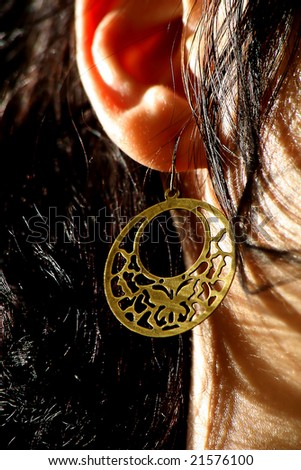 beautiful woman with a gold earing
