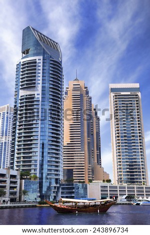 Dubai Marina with skyscrapers and boats in Dubai, United Arab Emirates