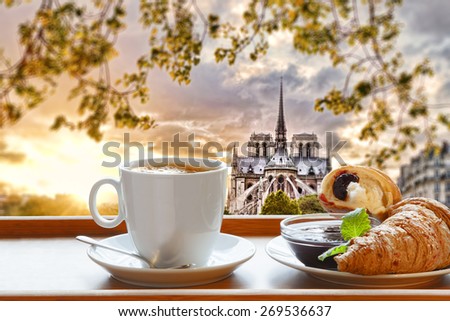 Notre Dame cathedral with coffee and croissants in Paris, France