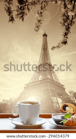 Coffee with croissants against Eiffel Tower in Paris, France
