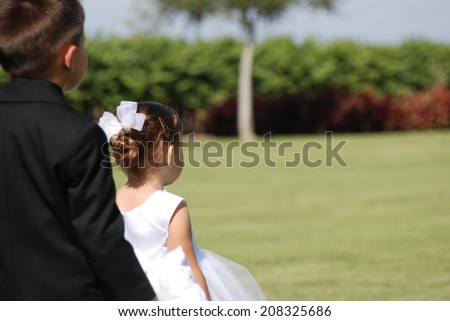 A cousin\'s wedding at a local winery proved to be a beautiful event. The flower girl and ring bearer were just adorable and took their jobs quite seriously.