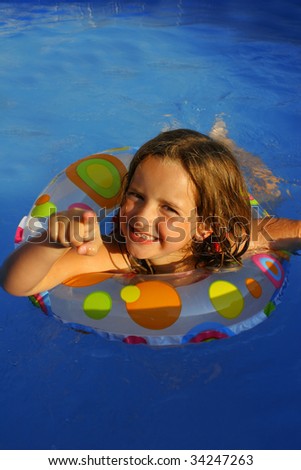 stock photo Little girl in pool