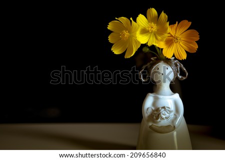 Vintage Child Doll  head  Vase with Yellow Flowers