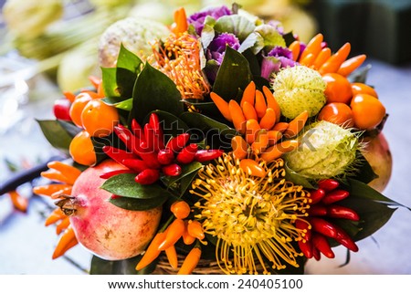 colorful bouquet of flowers and autumn fruits