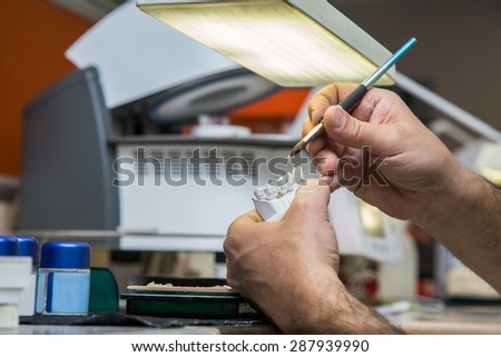 Dental laboratory, manufacturing dental prostheses