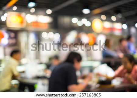 Food court and customer blurred background with bokeh and defocused lights