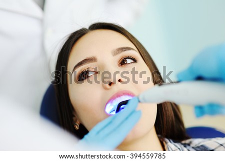beautiful girl at the dentist. Dental fillings