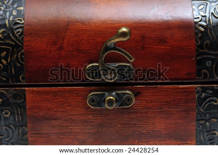 Fragment of wood chest with mending plates and latch