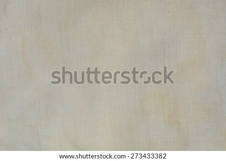 Stain on fabric in pale yellow and brown color