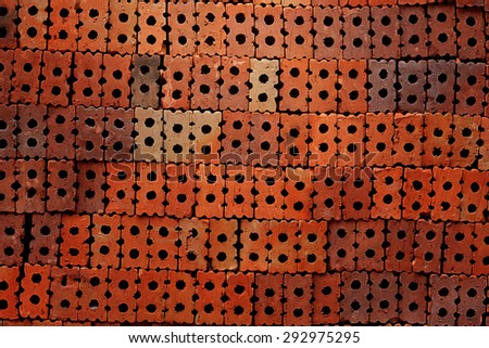Red brick wall texture grunge background with vignetted corners of interior