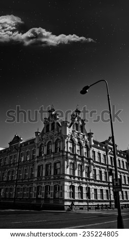 old school building with the night sky in monochrome