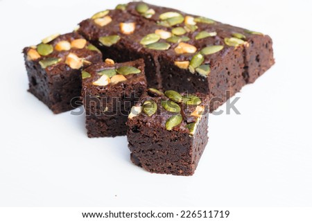 Brownie dessert and grains topping on white background