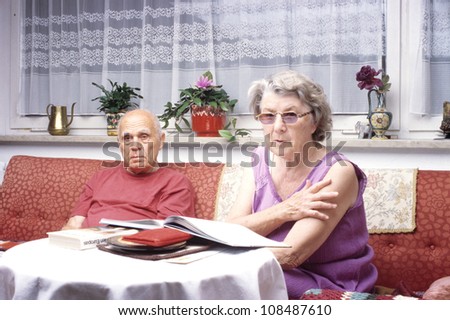 grandparents reading a book