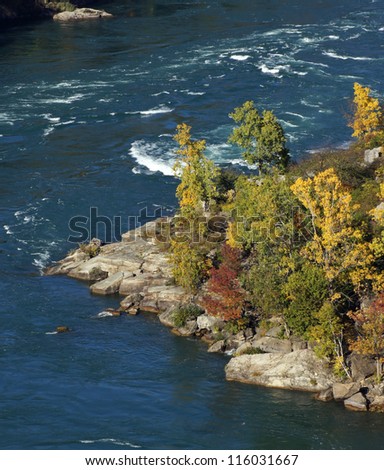 Water flows quickly through the Niagara River gorge, acting as the border between United States and Canada