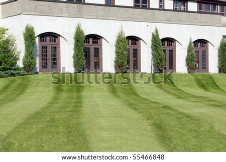 Fresh cut lawn leading up to a building