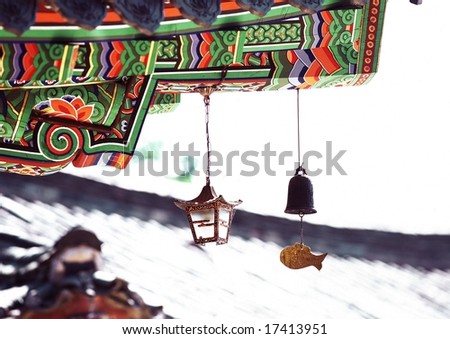 Korean Tradition and Symbol - artistic painted eaves of wooden architecture in Korea background with beautiful roof