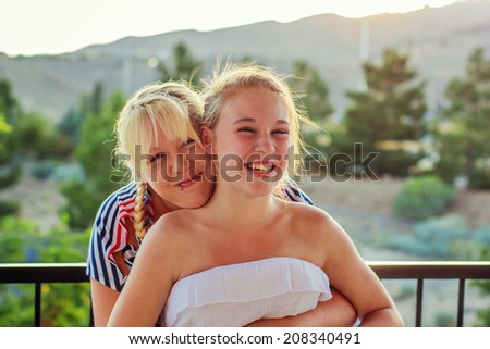 Mother and tween daughter together on Independence Day -- image taken in Reno, Nevada, USA