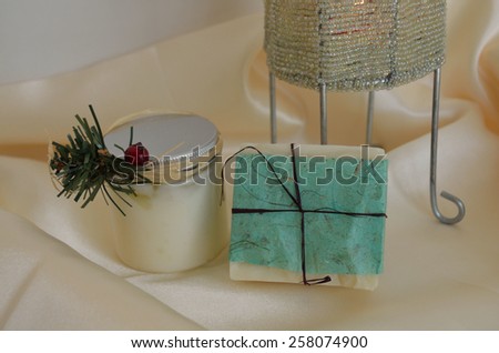 Decorative soap and lotion, on silk with candle base