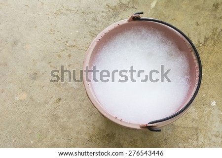 Bucket and foam used for  wash a car