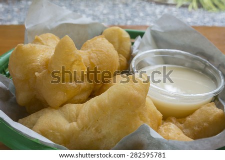 Breakfast in Thailand deep-fried doughstick and milk on white background, close-up