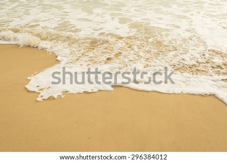 Sea wave and many foot print on the beach background,Soft-Focus