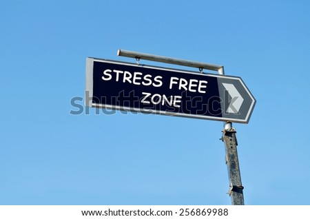 Stress free zone written on blue road sign with arrow