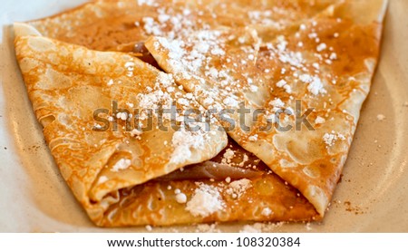French pancakes filled with chestnut and decorated with sugar powder