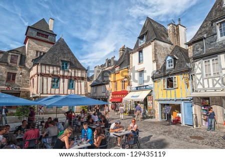 QUIMPER, FRANCE - AUGUST 31: Central place of Quimper on a sunny summer day. Quimper is very popular medieval tourist resort town in Brittany, France. Quimper, France on August 31, 2011