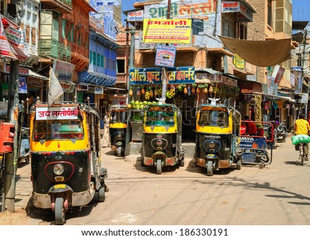 JODHPUR, INDIA - AUGUST 15: Auto rickshaws, also known as tuk-tuk, waiting for passengers on a daily market. Tuk-tuk is the most popular transport vehicle in India. Jodhpur, India, on August 15, 2012