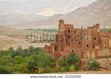 Berber traditional ksar - fortified clay city - Tamdaght in the near of Ait Benhaddou, Morocco. The old kasbah accommodates modern luxury hotel.