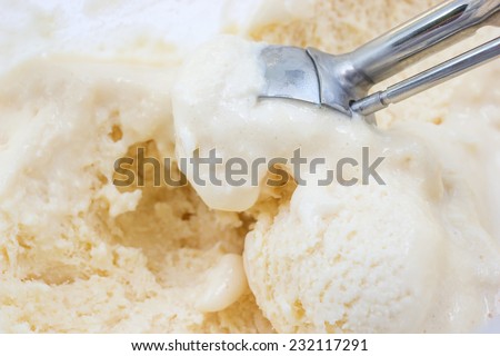 Closeup lemon ice cream with scooper.