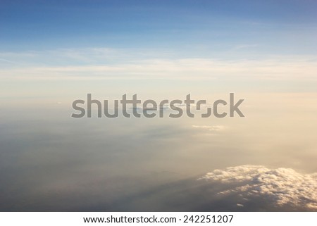Blue sky and cloud. With light of evening. Window airplane view.