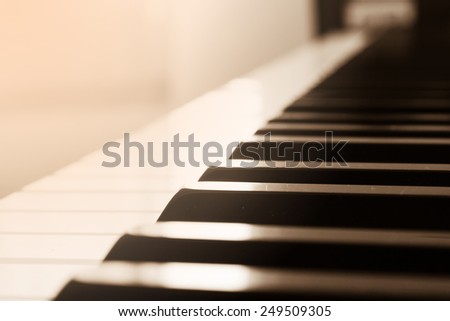 Abstract and blur background. Closeup piano keyboard. Sepia tone. With color filter.