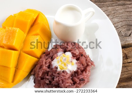 Mango with sticky rice and  coconut milk topping. Traditional dessert of thailand. Favorite dessert in summer time.