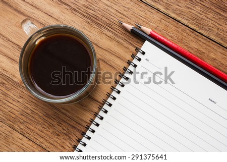 Concept background of business and education. Black coffee,  notebook and pencils. Top view.