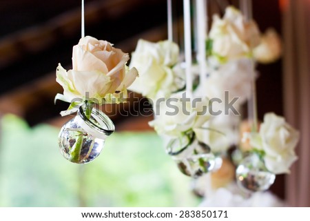 Flowers in bulbs hang in a wedding party