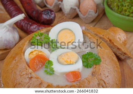 Easter white borscht with eggs and sausage in bread bowl