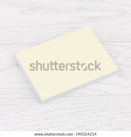Pack of sticky stickers note on wooden white background