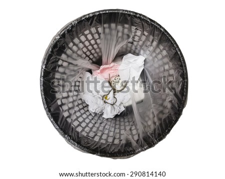 Pocket watch in refuse bin isolated on white background. Top view. Concept of wasting time