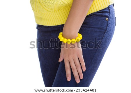 yellow sweater and accessory in the form of a bracelet isolated