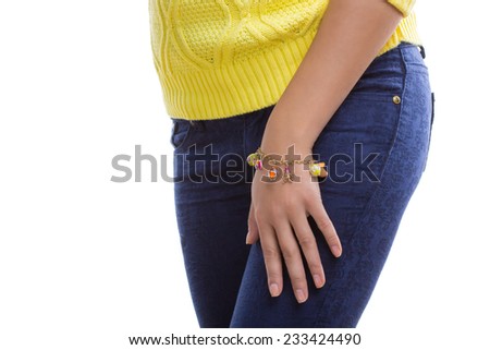 yellow sweater and accessory in the form of a bracelet isolated