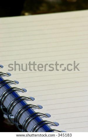 A notepaper spiral bound with visible lines, suitable to add own words.